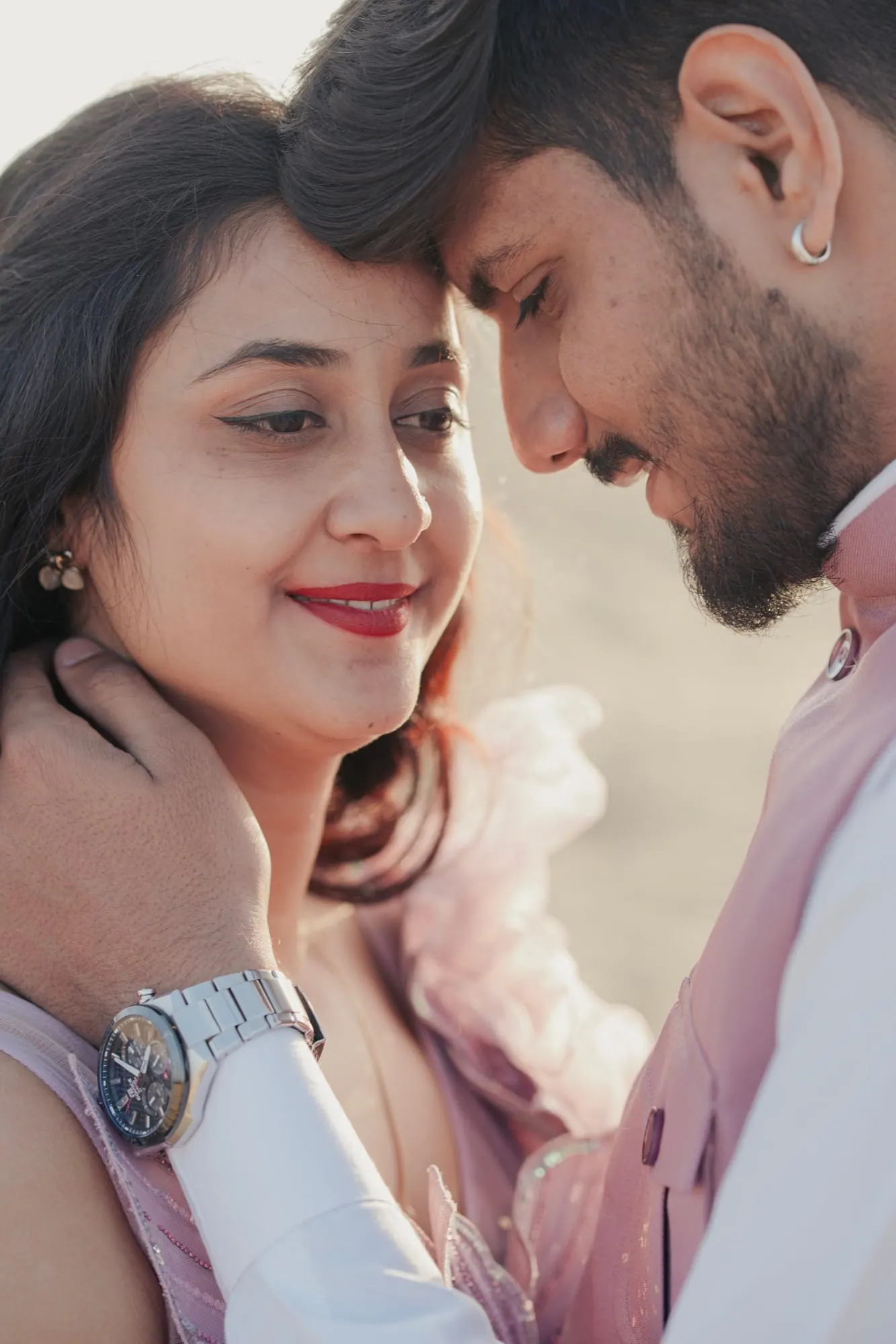 Playful couple frame during a pre-wedding shoot